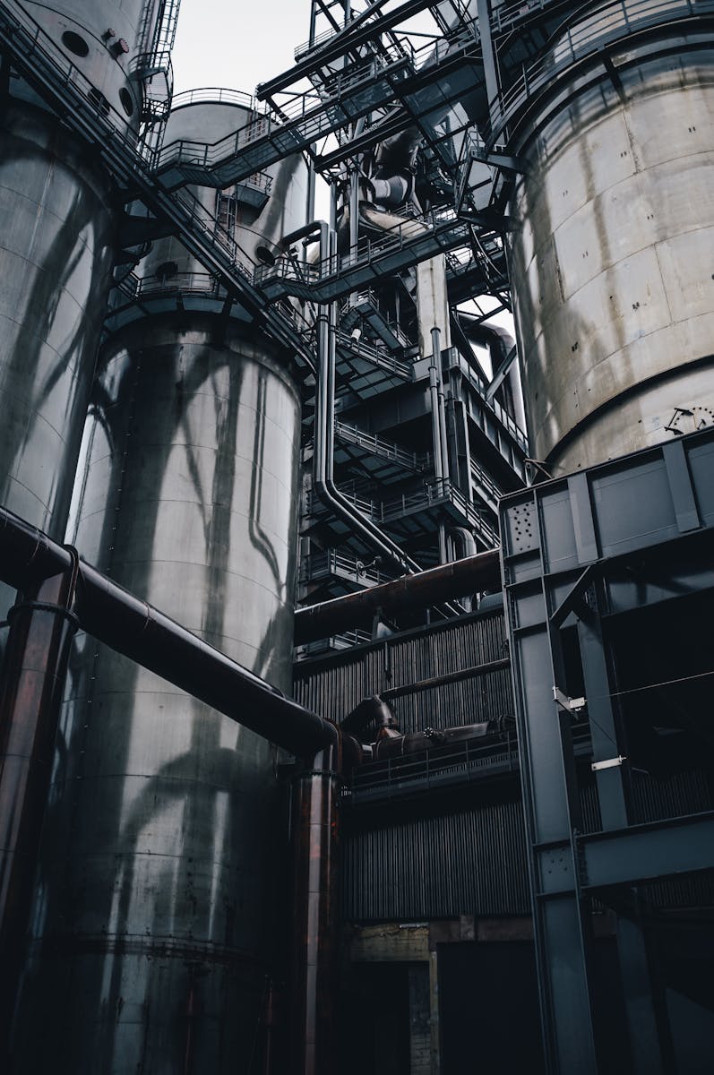 Low Angle Shot of Silos and a Metal Construction, manufacturers